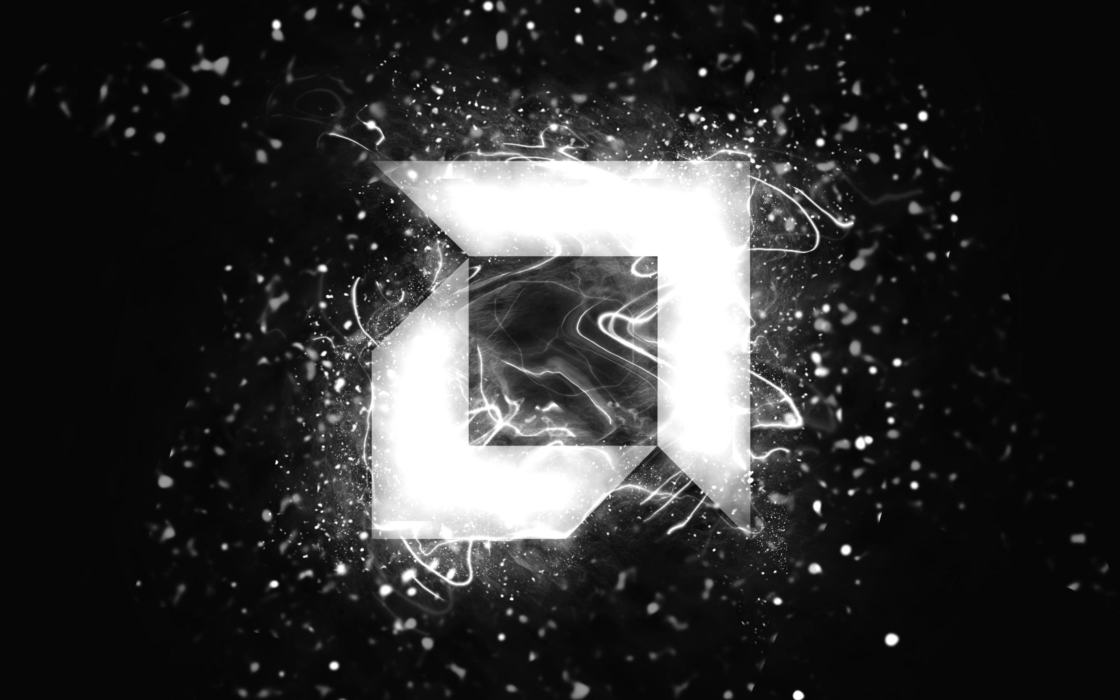 AMD 桌布 壁紙 — 一個發光的抽象幾何形狀在充滿粒子的黑暗背景上以電能脈動。