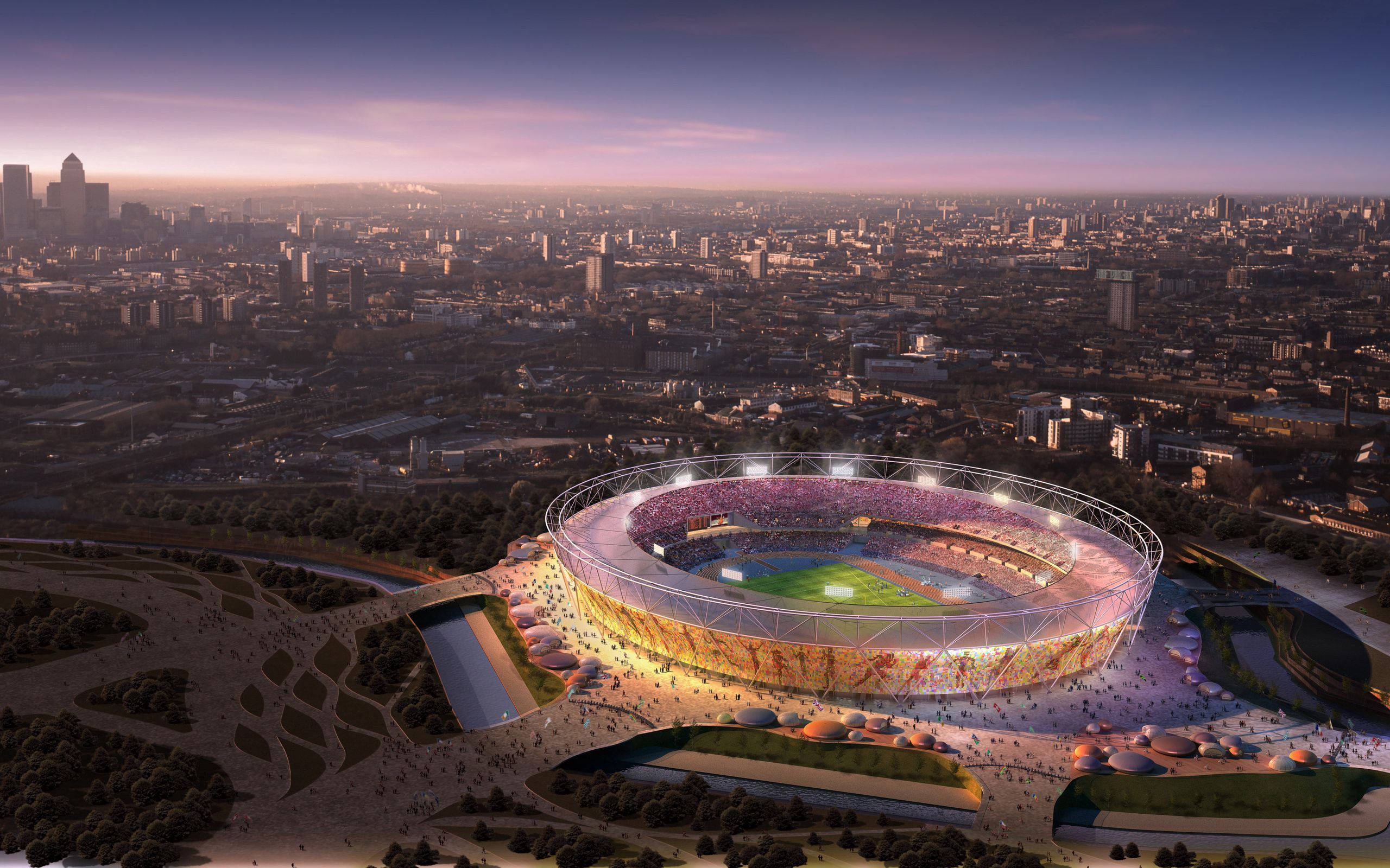 Olympics 桌布 壁紙 — 一個發光的未來主義體育場在黃昏時分照亮了廣闊的城市景觀，暖色燈光映襯著紫色天空。