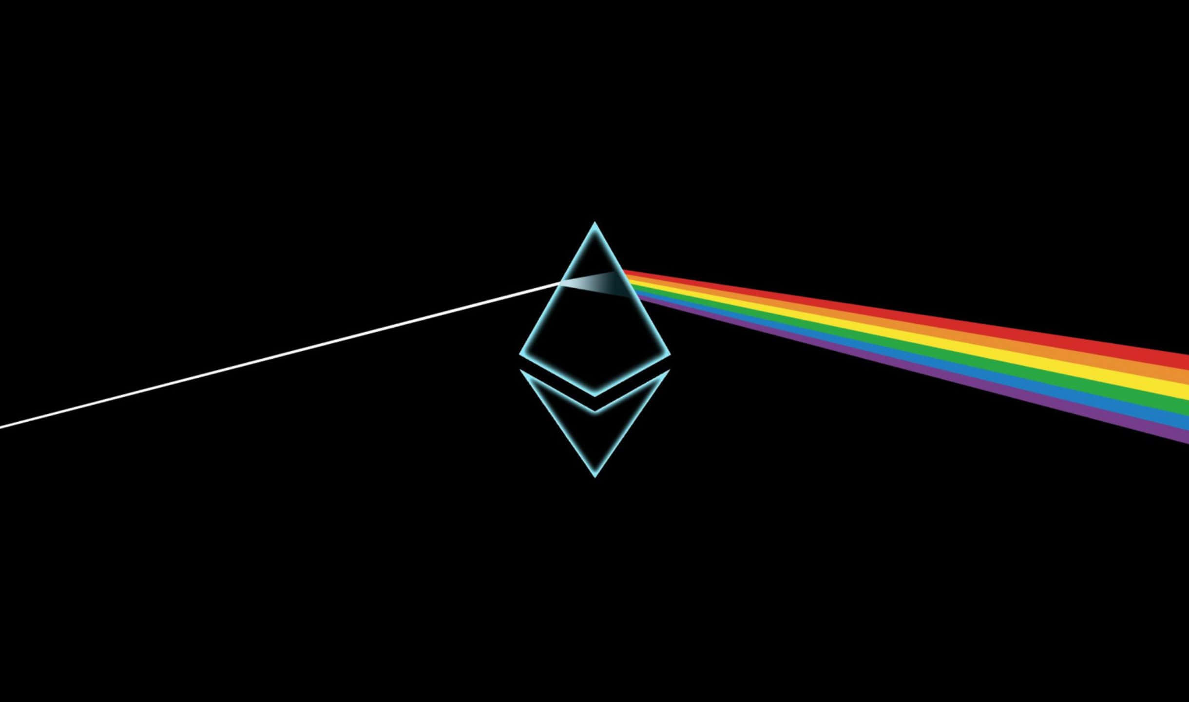 2440x1440 Desktop Pc 桌布 壁紙 — 一個發光的棱鏡將白色光束分裂成一個鮮豔的彩虹光譜，背景是黑色。