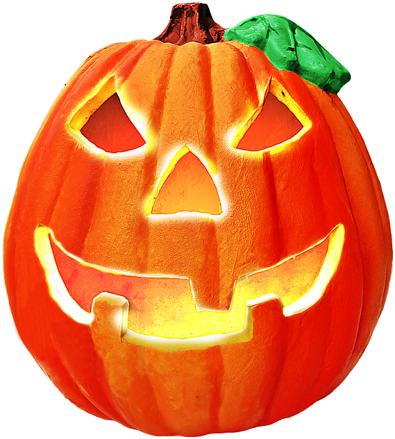 Jack O Lantern 桌布 壁紙 — 一個發光的橙色南瓜燈，帶有雕刻的笑容和三角形眼睛，在黑色背景上散發出溫暖的光芒。