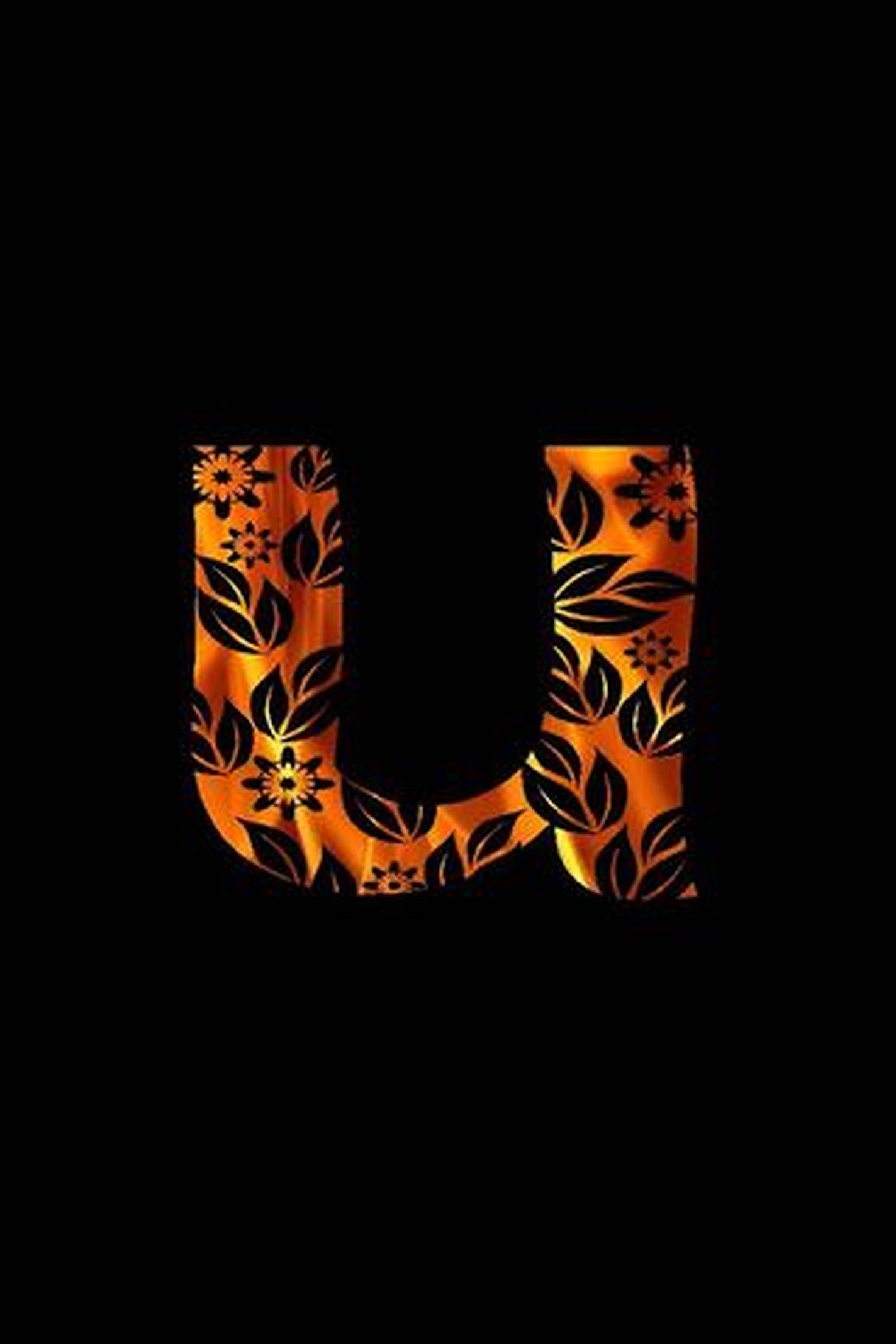U 桌布 壁紙 — 一個發光的橙色字母U，飾有黑色花卉圖案，在純黑色背景上脫穎而出。