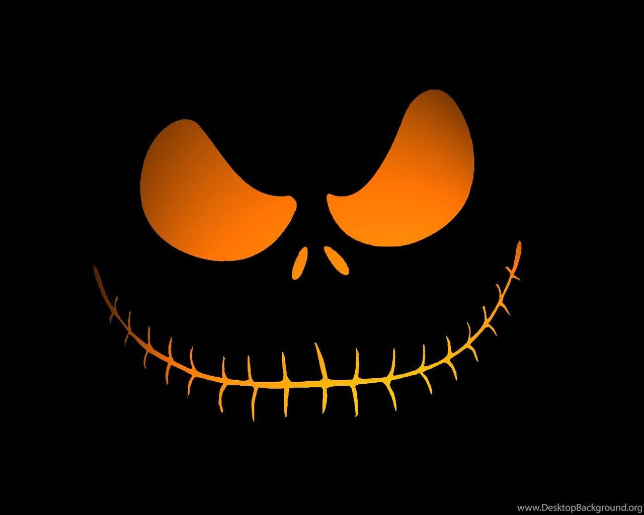 Cute Skeleton 桌布 壁紙 — 一個發光的橙色縫合笑臉，大眼睛，在黑色背景上。