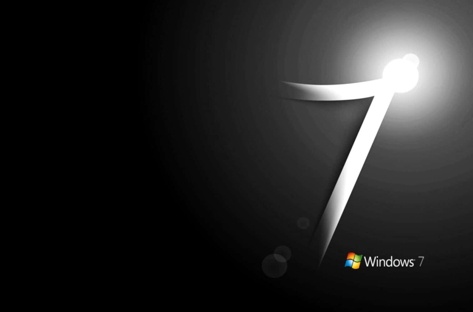 Black Windows 桌布 壁紙 — 一個發光的白色數字7從黑暗中浮現，帶有柔和的光線和散景效果，背景為黑色。