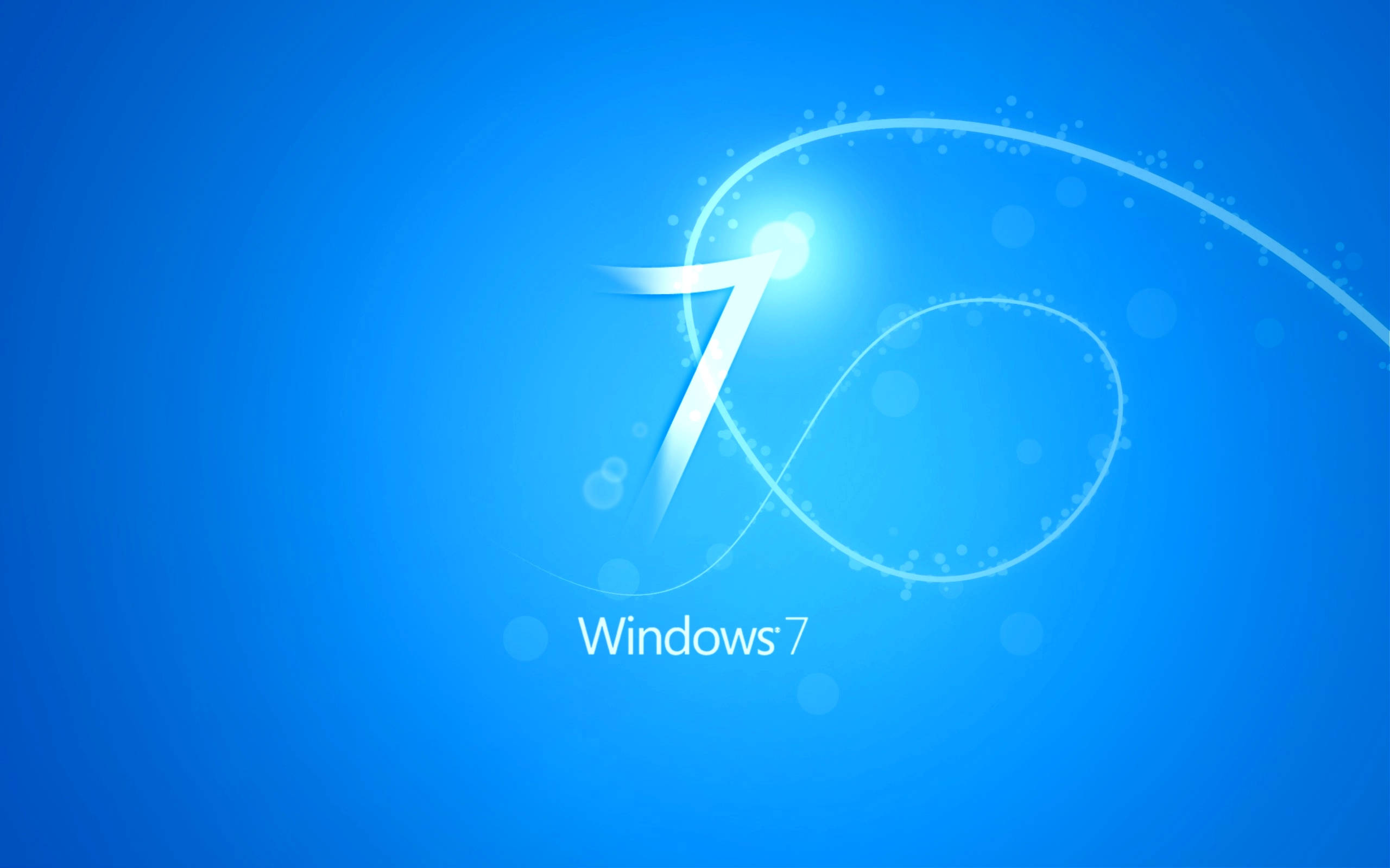 Windows 7 桌布 壁紙 — 一個發光的白色數字七在漸變藍色背景上旋轉，帶有柔和散景燈光，下方有文字 Windows 7。