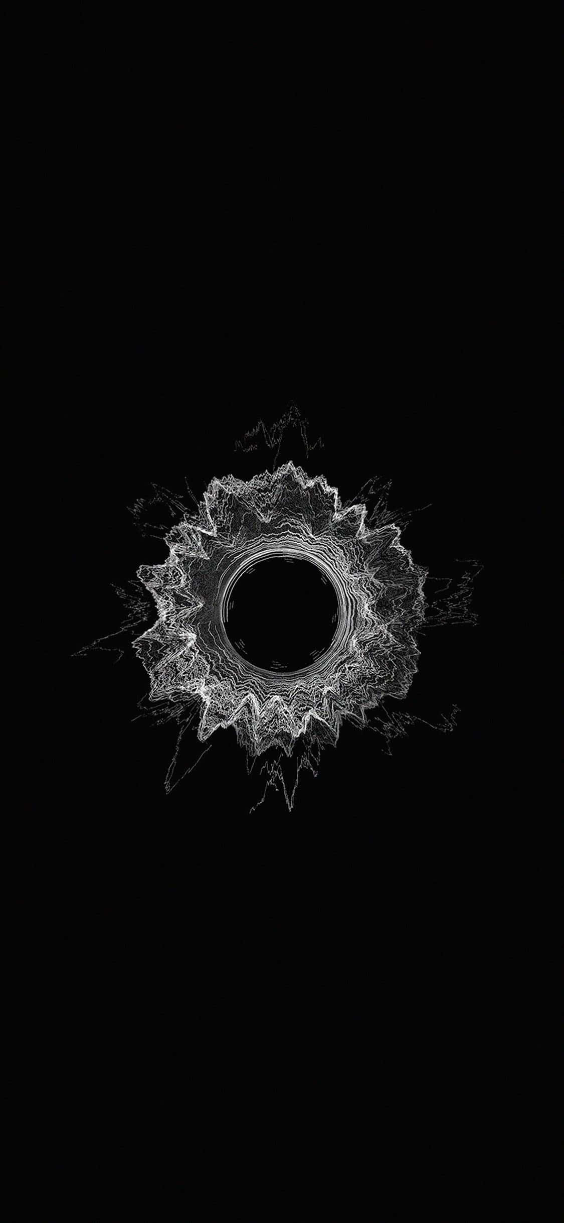 Minimalist Pattern 桌布 壁紙 — 一個發光的白色碎形曼陀羅從中央虛空向純黑色背景輻射。