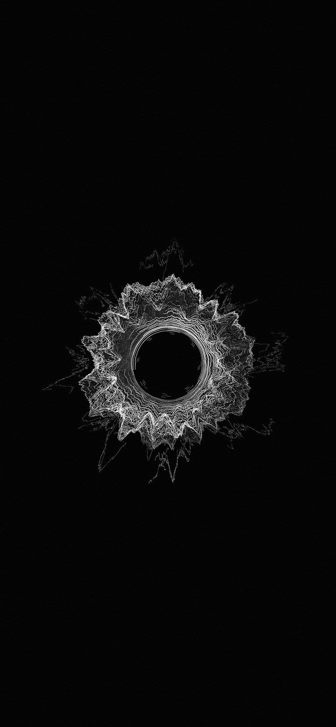 minimal dark iPhone 桌布 壁紙 — 一個發光的白色碎形曼陀羅從中央虛空向純黑色背景輻射。