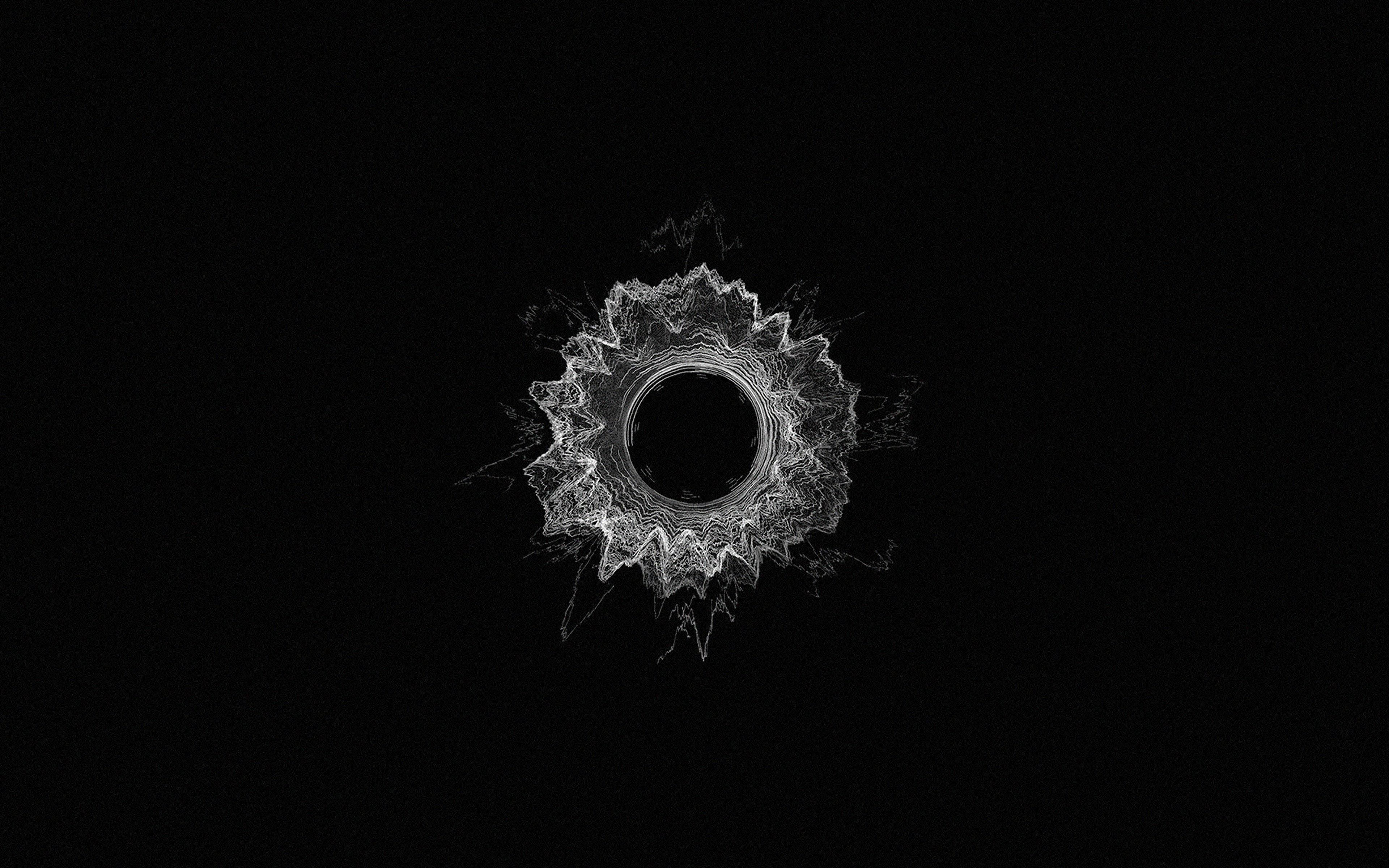 Dark Minimalist 桌布 壁紙 — 一個發光的白色碎形曼陀羅從中央虛空向純黑色背景輻射。