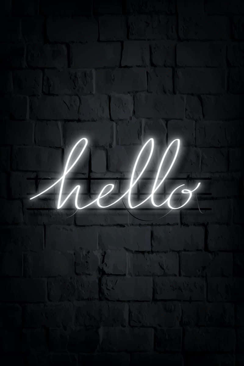 White Neon 桌布 壁紙 — 一個發光的白色草書霓虹燈牌拼出hello，在深色紋理磚牆上投射出柔和的光線。