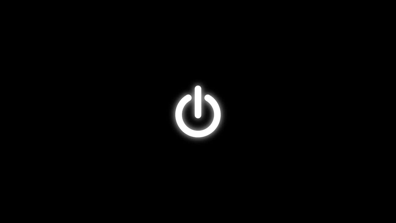 黑色 桌布 壁紙 — 一個發光的白色電源按鈕圖示，居中於純黑色背景上。
