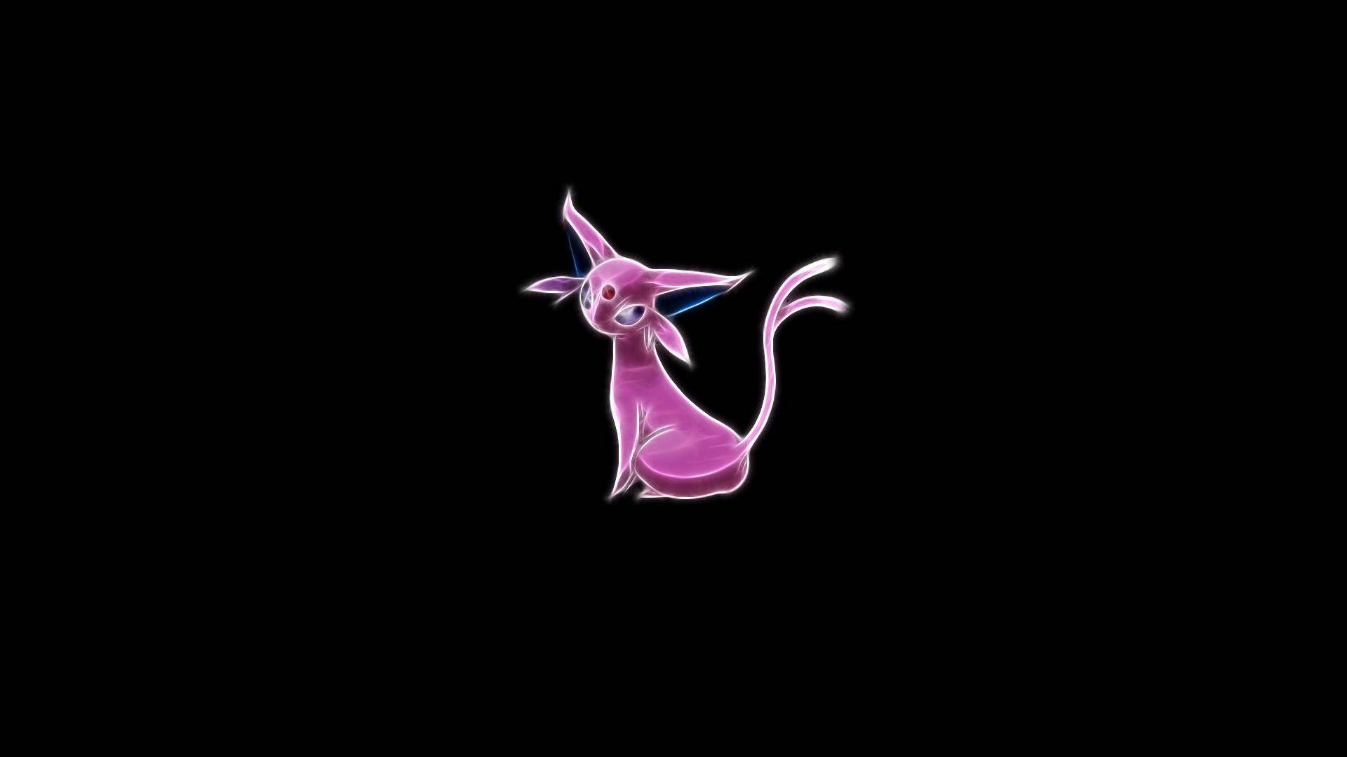 espeon 桌布 壁紙 — 一個發光的粉紅色動漫貓狀生物，帶有藍色點綴，坐在純黑色背景中央。