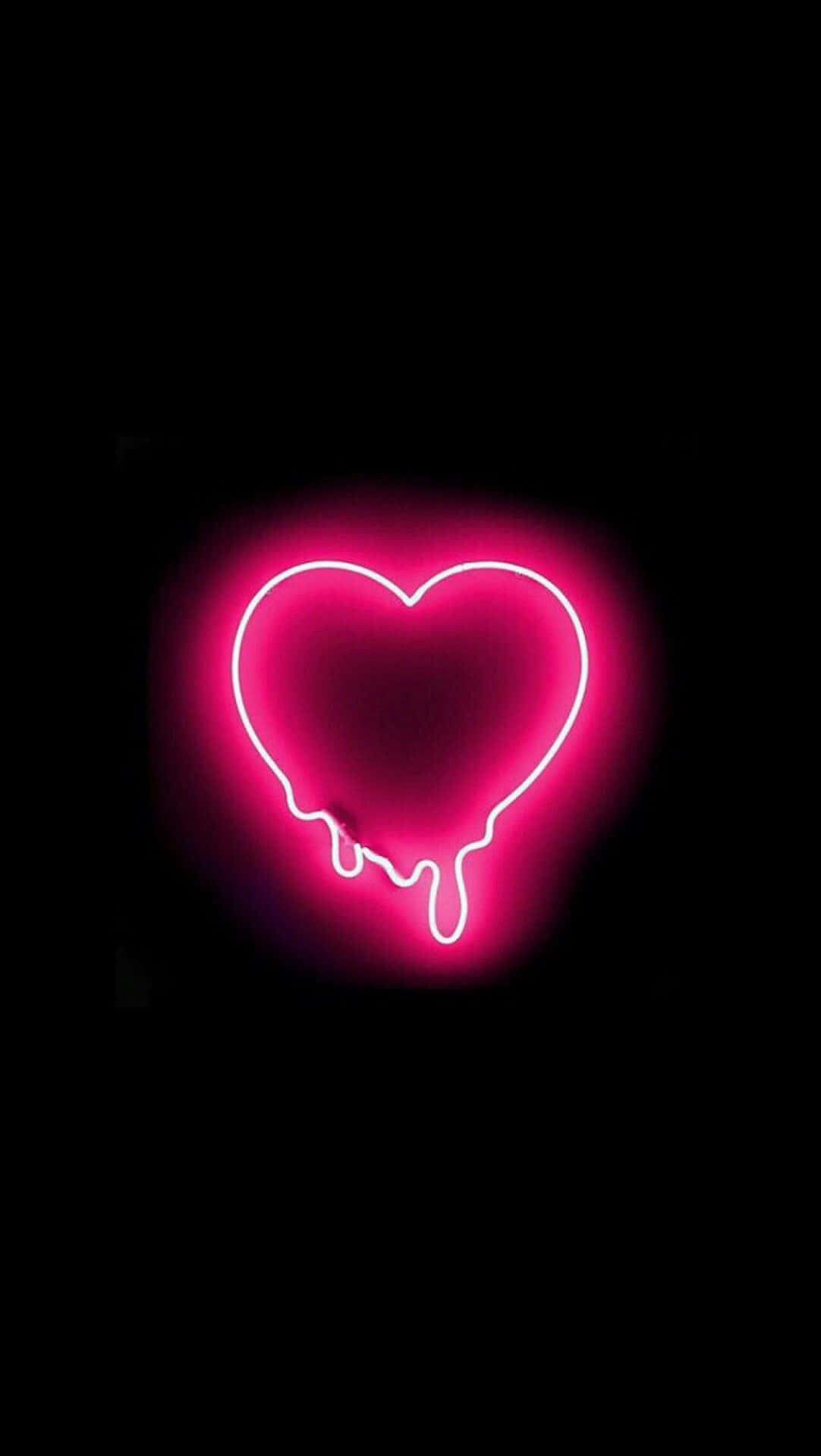 Cute Neon Pink 桌布 壁紙 — 一個發光的粉紅色霓虹心形，帶有融化滴落，背景為純黑色。