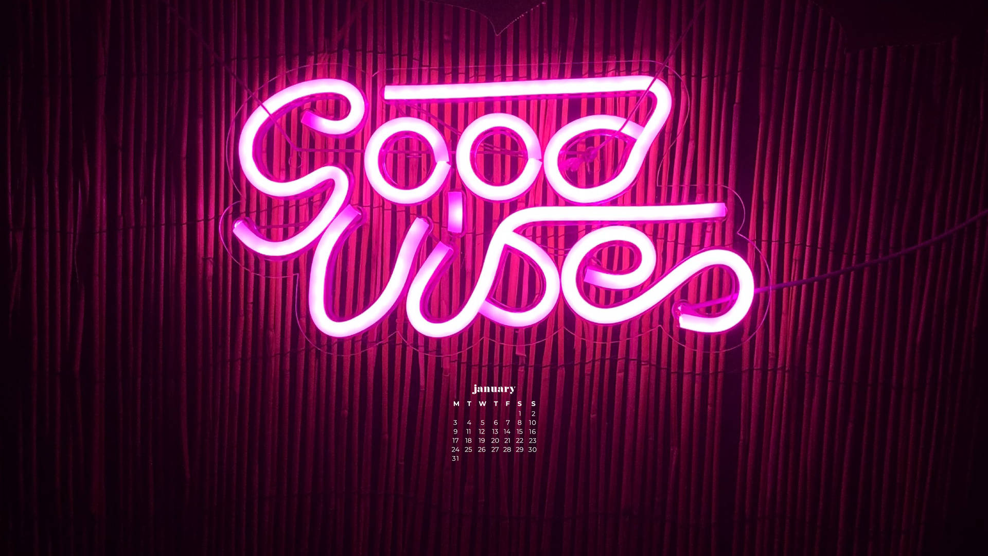 粉紅色霓虹燈牌寫著 Good Wishes 在竹牆上，附有一月日曆。 — 一月 GIF 壁紙