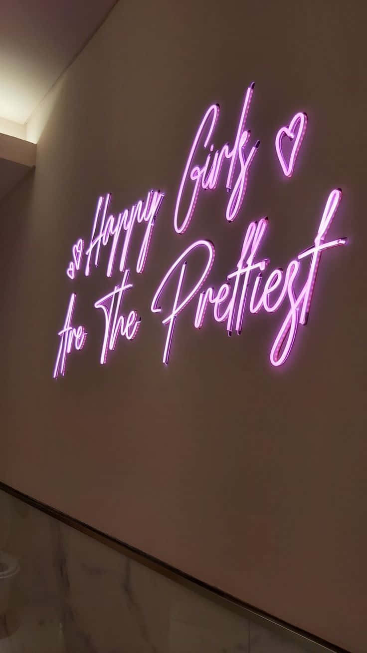 語錄 桌布 壁紙 — 一個發光的粉紅色霓虹燈牌，上面寫著「Happy Girls Are The Prettiest」，並有心形符號，掛在米色牆上。
