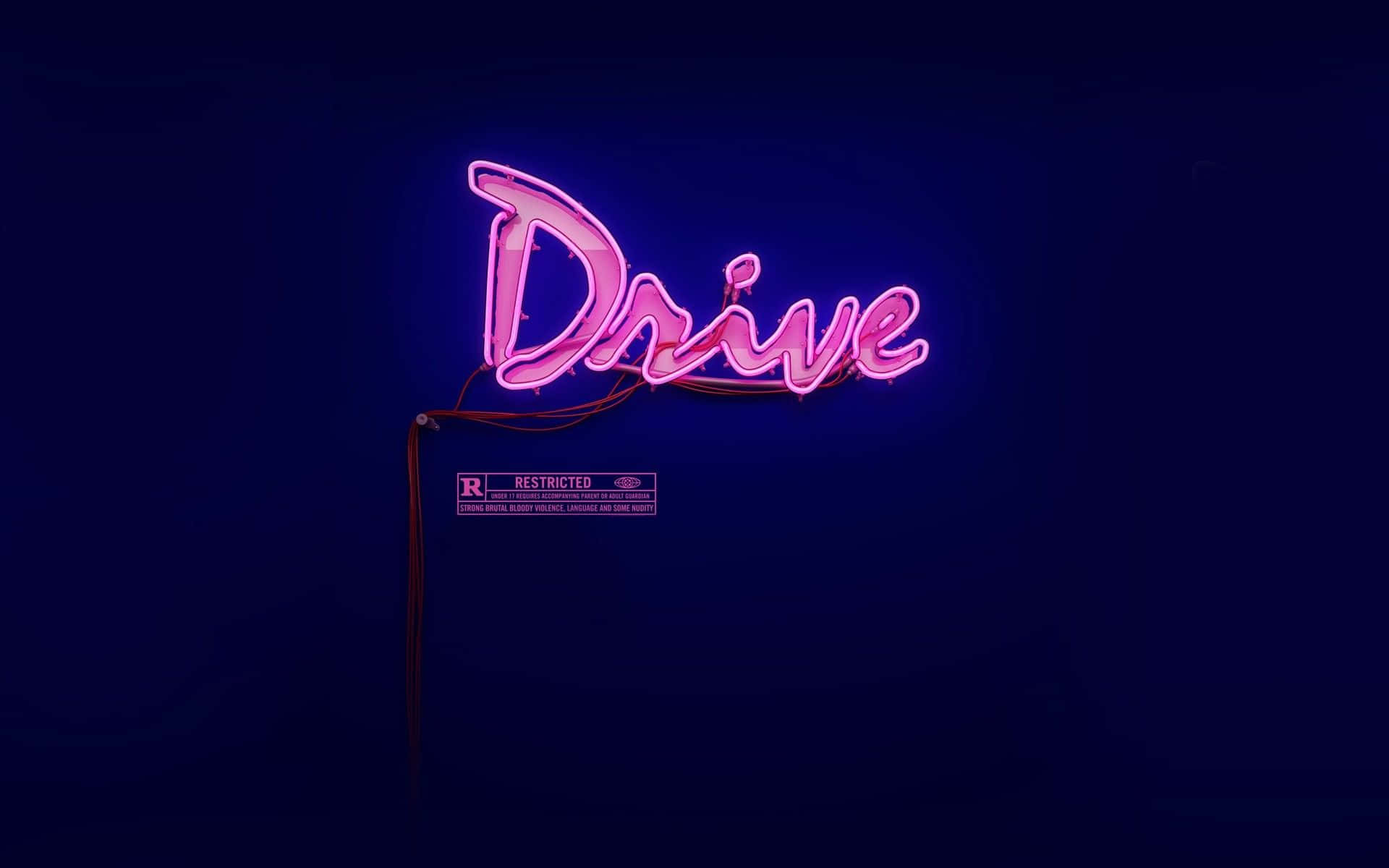 Neon Quotes 桌布 壁紙 — 一個發光的粉紅色霓虹燈牌，在深藍色夜空下拼出「Drive」，下方有一個「Restricted」標籤。