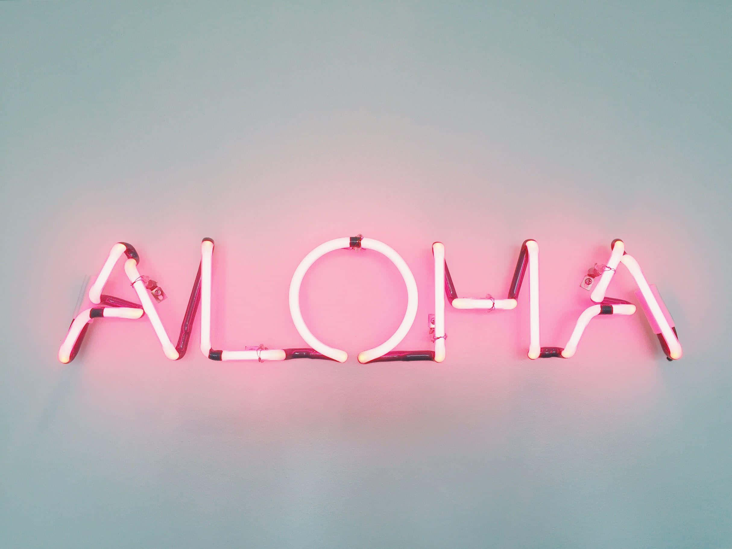 藝術 桌布 壁紙 — 一個發光的粉紅色霓虹燈牌，拼寫著「ALOHA」，在柔和的青綠色牆壁上投射出溫暖柔和的光芒。