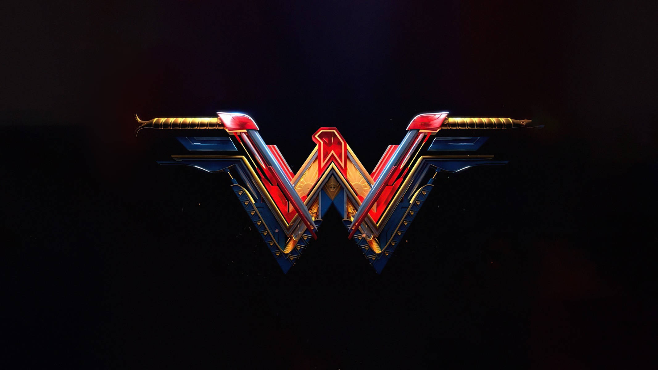 Wonder Woman 桌布 壁紙 — 一個發光的紅、藍、金色神力女超人標誌在黑暗背景上閃耀，帶有戲劇性的燈光效果。