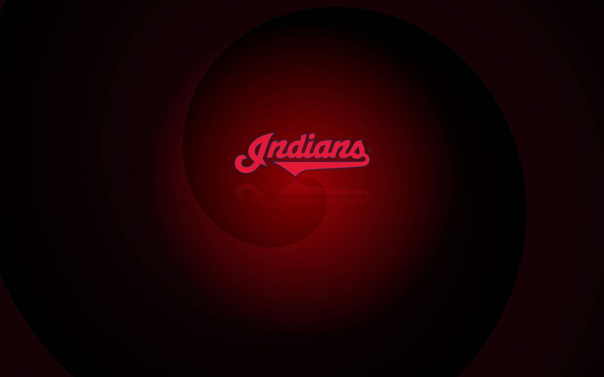 Cleveland Indians 桌布 壁紙 — 一個發光的紅色「Indians」標誌，位於黑暗圓形隧道中央，帶有徑向光線漸變。
