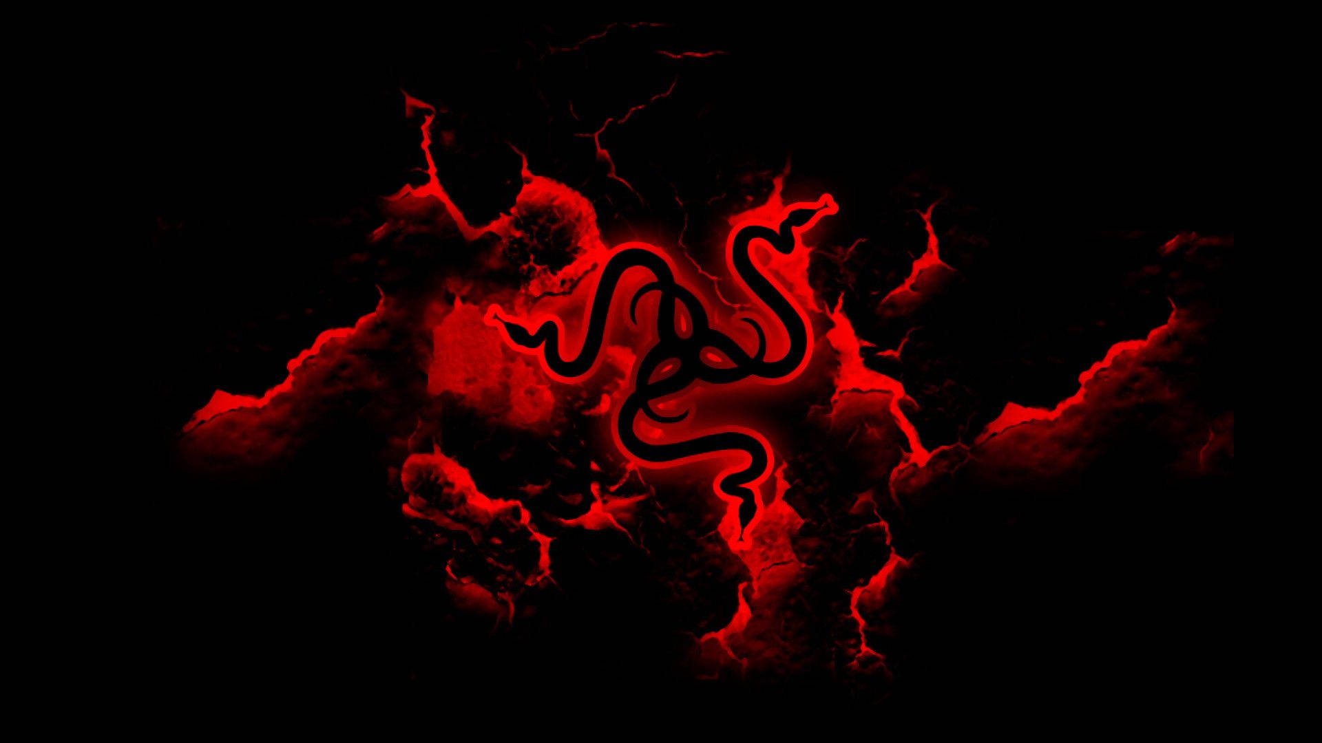 Cool Red 桌布 壁紙 — 一個發光的紅色Razer標誌從熔岩中浮現，背景為黑色。
