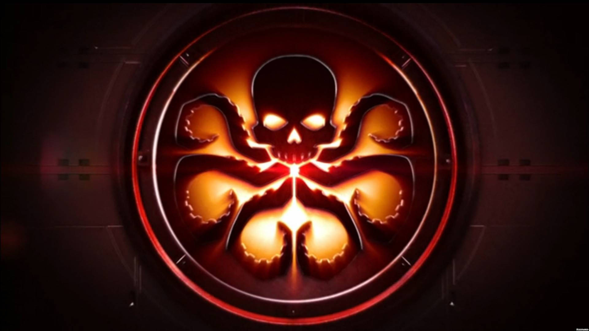 Marvel Logo 桌布 壁紙 — 一個發光的紅色和橙色骷髏頭，帶有章魚觸手，從一個圓形金屬徽章中散發出來，背景為深色。