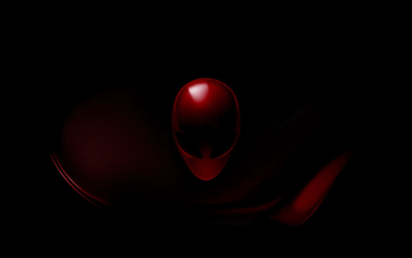 alienware logo 桌布 壁紙 — 一個發光的紅色外星人頭標誌從黑暗中浮現，帶有流暢的曲線和反光表面。