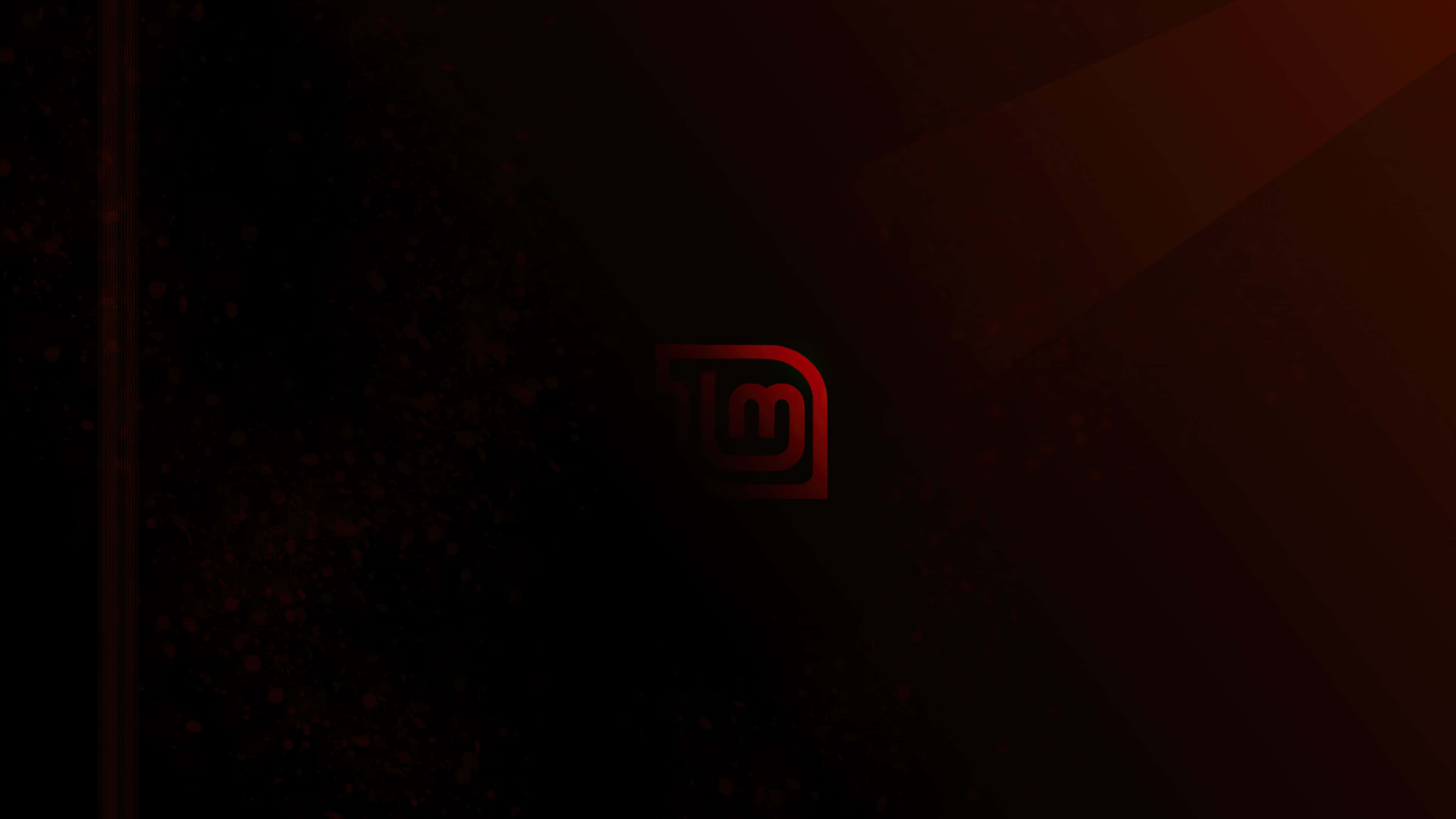 Ubuntu 4K 桌布 壁紙 — 一個發光的紅色抽象標誌漂浮在深色漸變背景上，帶有微妙的粒子效果。