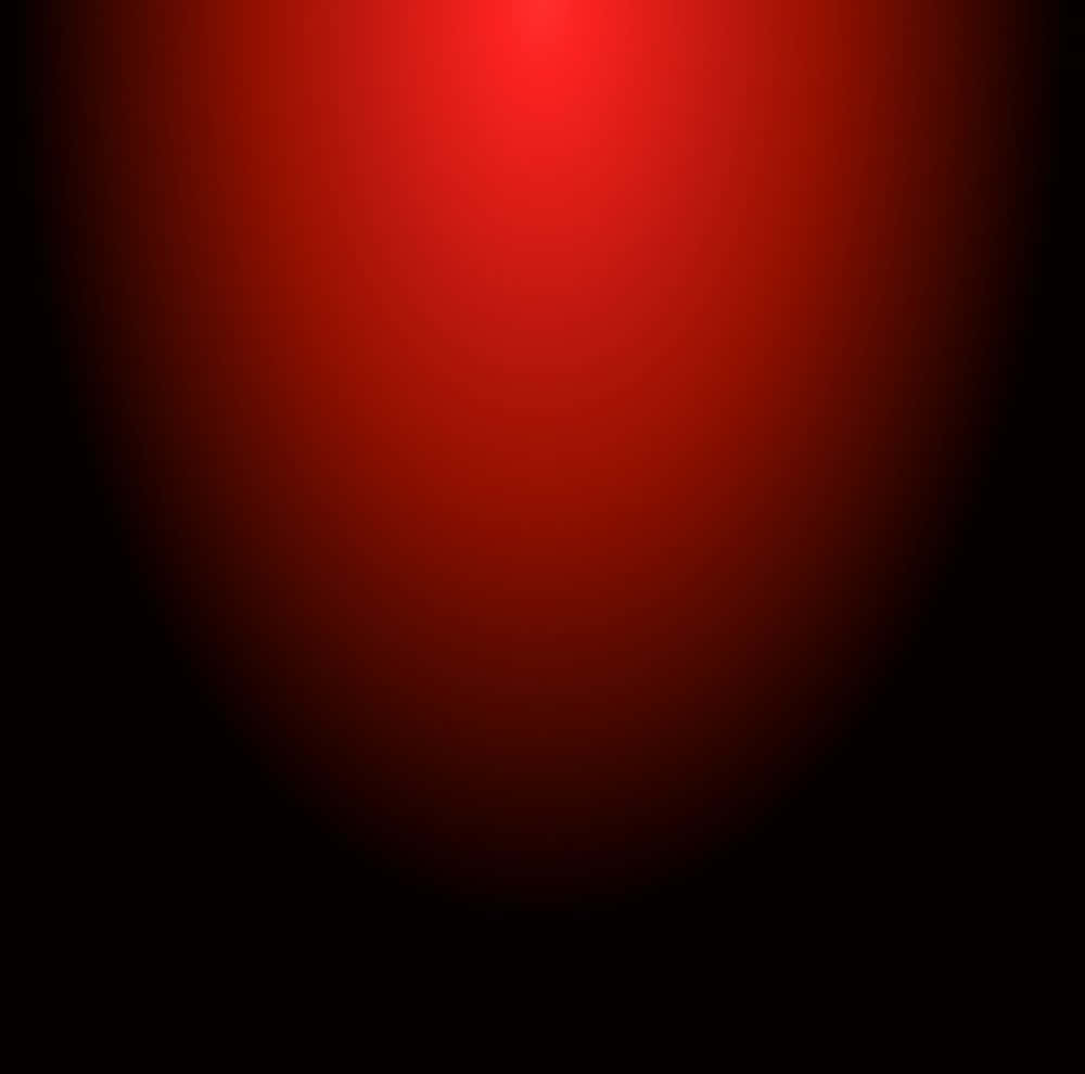 Red Light 桌布 壁紙 — 一個發光的紅色漸變球體逐漸融入黑色，營造出極簡的宇宙或抽象光效。