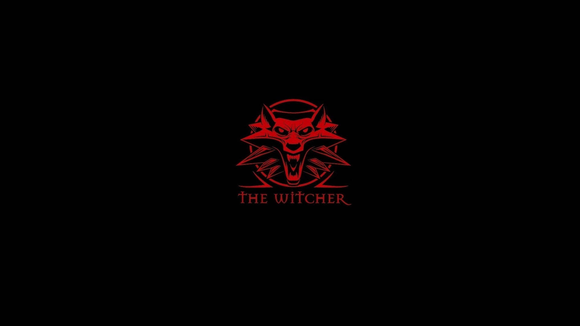 藝術 桌布 壁紙 — 一個發光的紅色狼頭標誌，中央有「THE WITCHER」文字，背景為黑色。