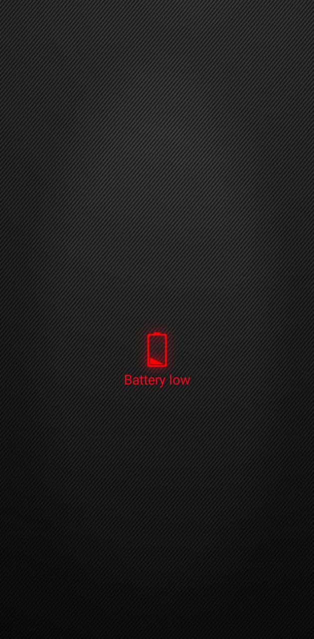 battery 桌布 壁紙 — 一個發光的紅色電池電量低圖示，居中在深色紋理背景上。