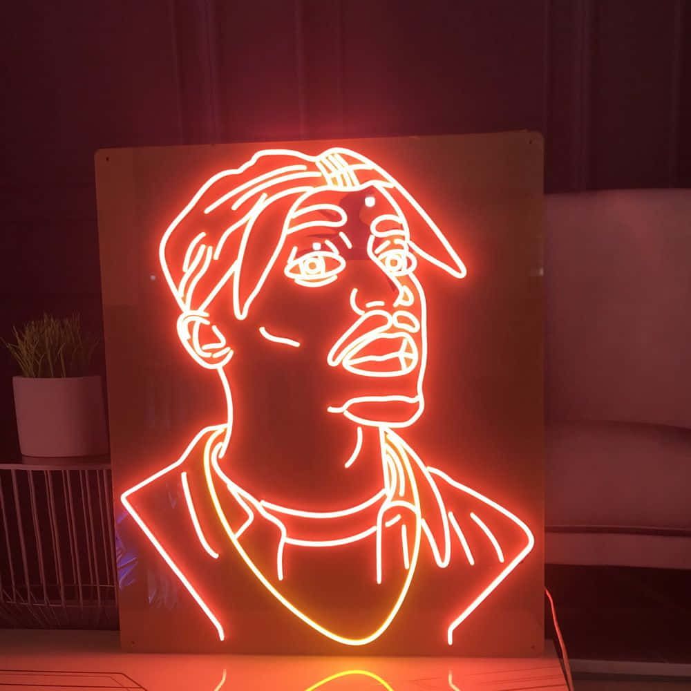 Red Led 桌布 壁紙 — 一個發光的紅色霓虹燈牌，描繪了一個在昏暗房間裡戴著帽子的男士風格化肖像。