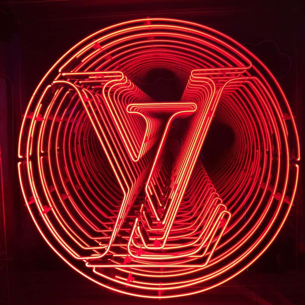 LED 桌布 壁紙 — 一個發光的紅色霓虹燈牌在黑暗背景上的同心圓管內形成重複的 Louis Vuitton 標誌。