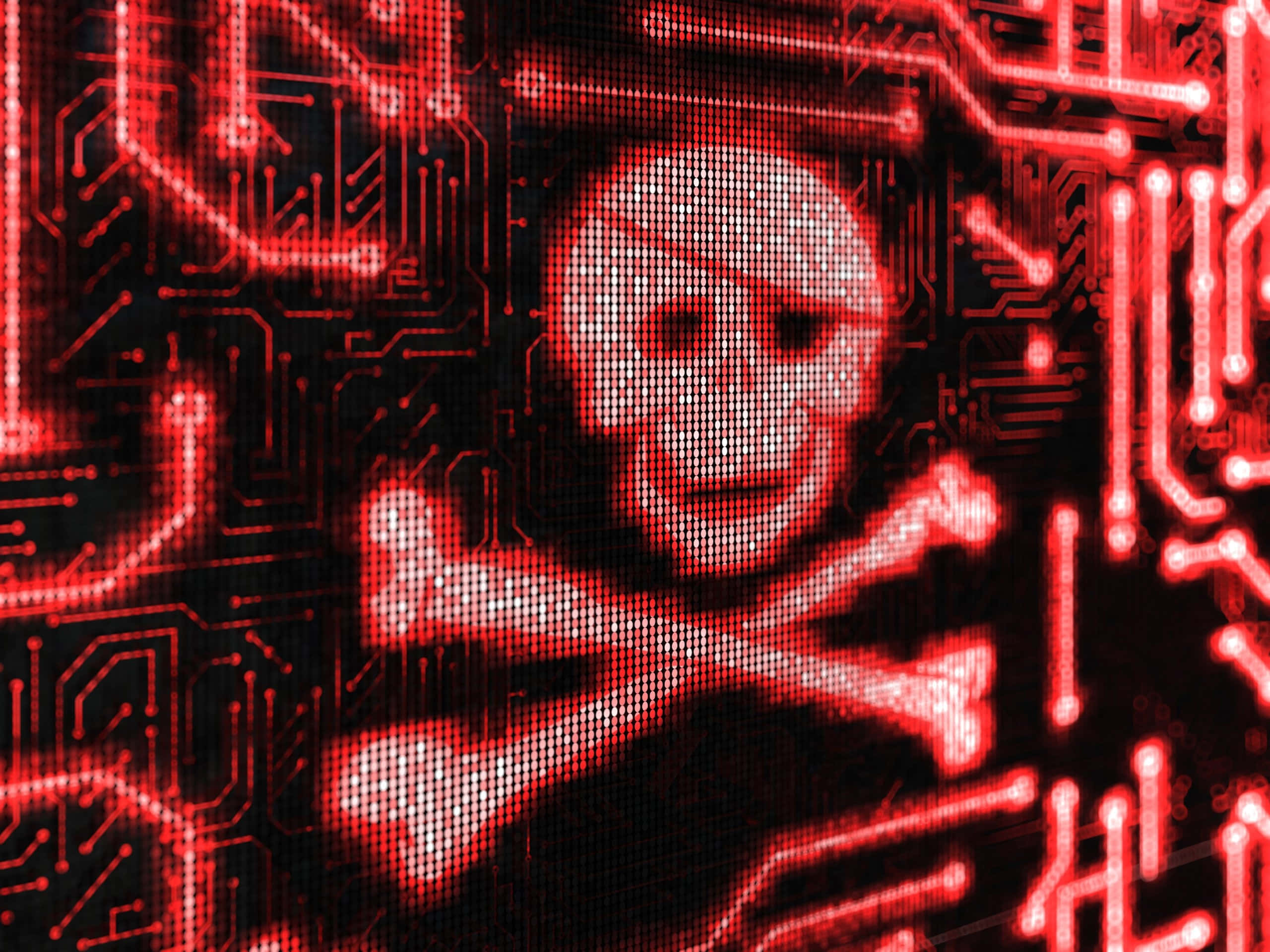 Dark Web 桌布 壁紙 — 一個發光的紅色骷髏頭和交叉骨符號在數位電路板背景上脈動。