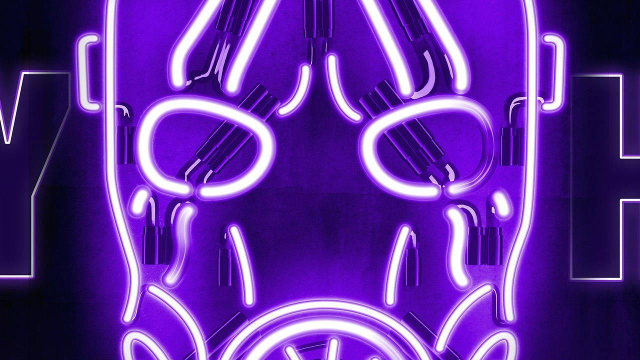Borderlands 3 桌布 壁紙 — 一個發光的紫色霓虹燈牌，形狀像一個風格化的人臉，帶有發光的眼睛和嘴巴，背景為黑色。