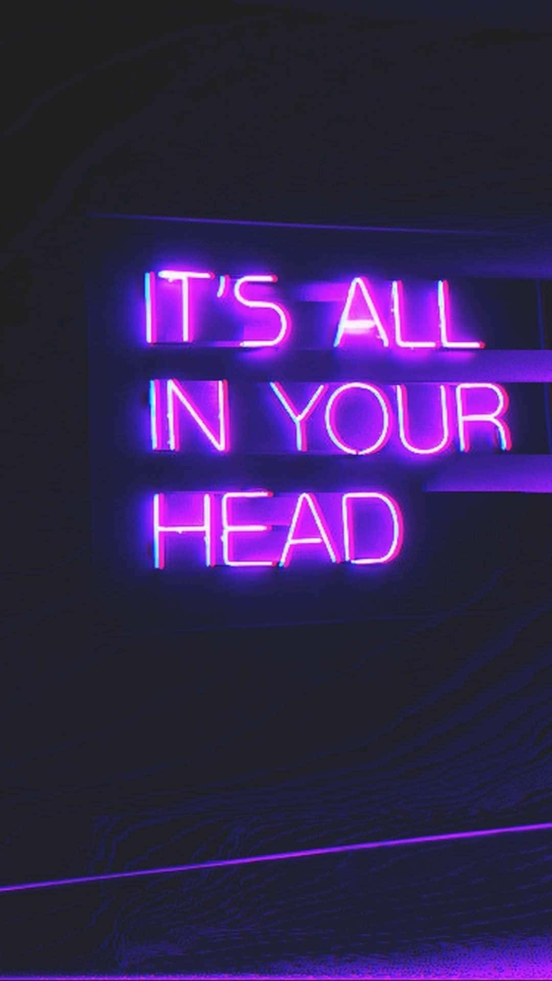 Neon Lights Aesthetic 桌布 壁紙 — 一個發光的紫色霓虹燈牌在深色紋理牆上顯示 it's all in your head。