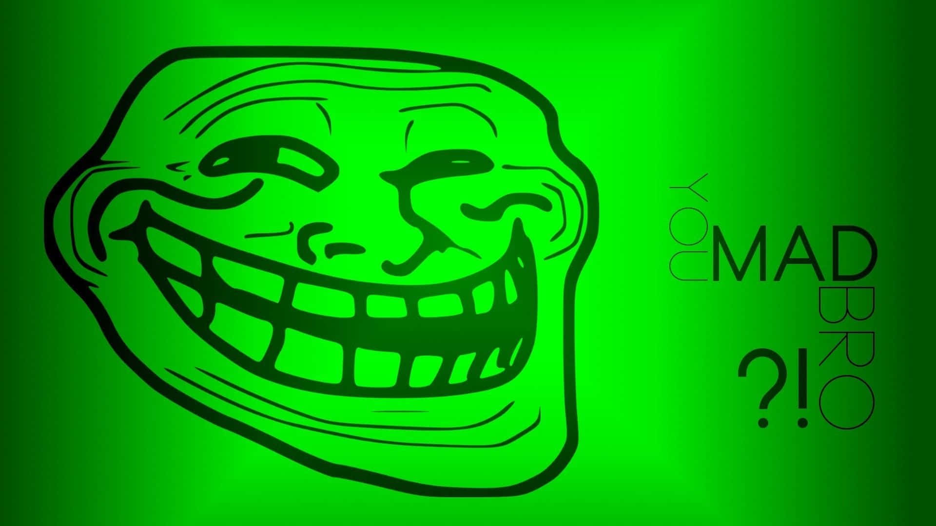 meme 桌布 壁紙 — 一個發光的綠色 troll 臉，咧嘴大笑，並帶有文字 'You mad bro?!'，背景為漸變色。