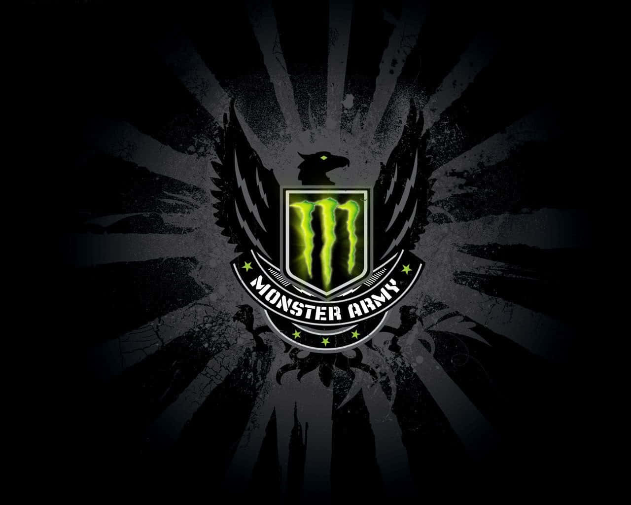 怪物 桌布 壁紙 — 一個發光的綠色Monster Army標誌，帶有鷹頭和翅膀，在黑暗粗糙的背景上散發出太陽光線。