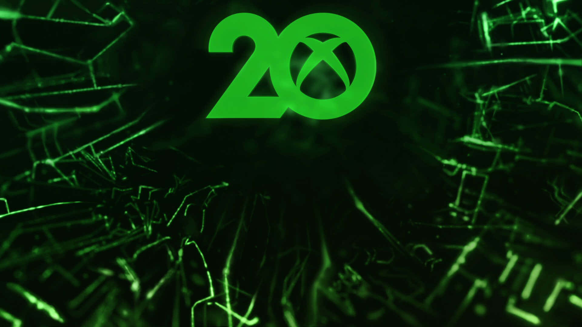 Xbox 桌布 壁紙 — 一個發光的綠色Xbox 20標誌在黑暗背景上透過裂紋玻璃效果閃耀。
