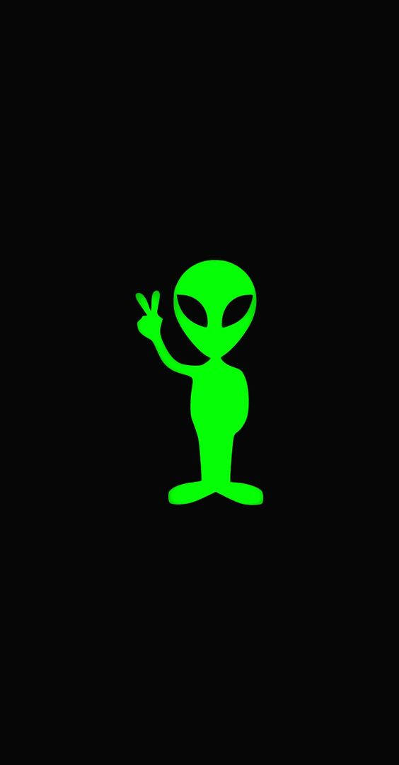 Green Anime 桌布 壁紙 — 一個發光的綠色外星人剪影在純黑色背景上做出和平手勢。