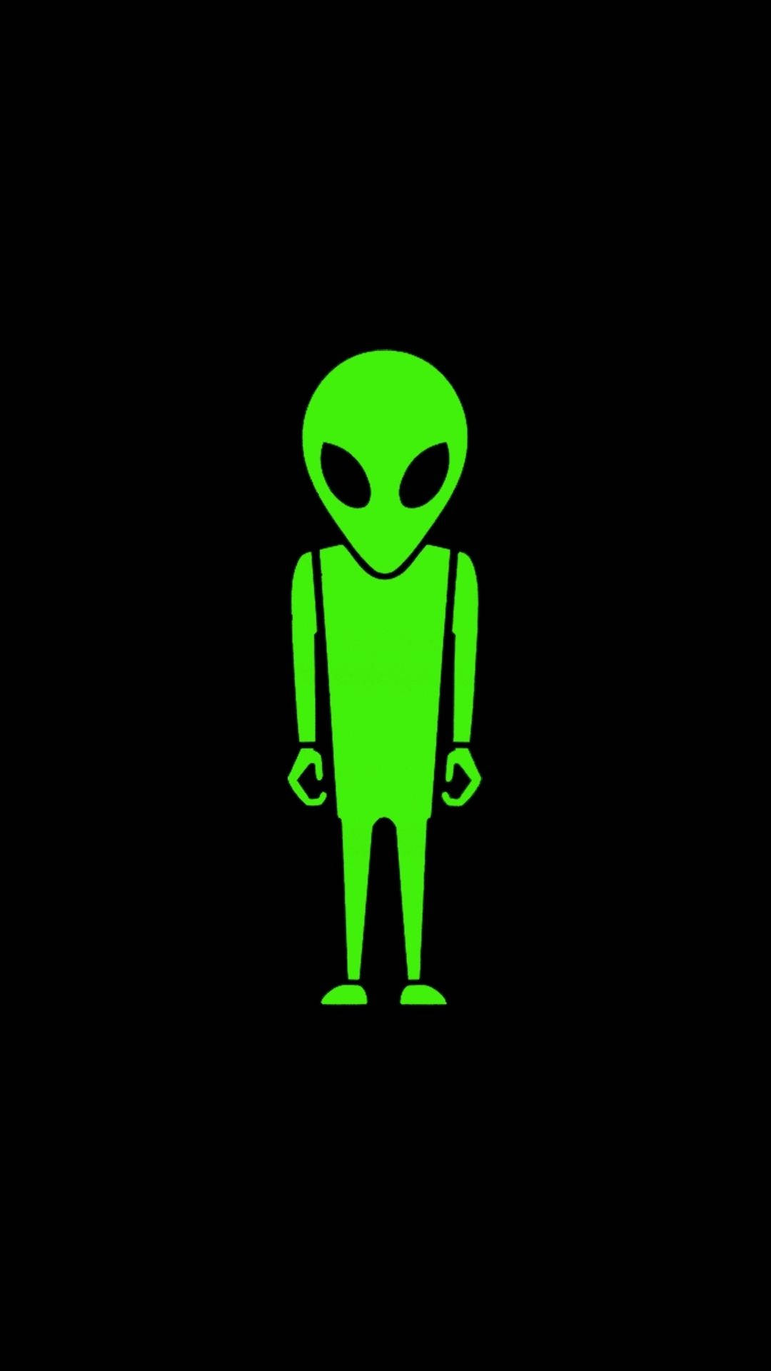 外星人 桌布 壁紙 — 一個發光的綠色外星人形象以極簡輪廓立於純黑背景中央。