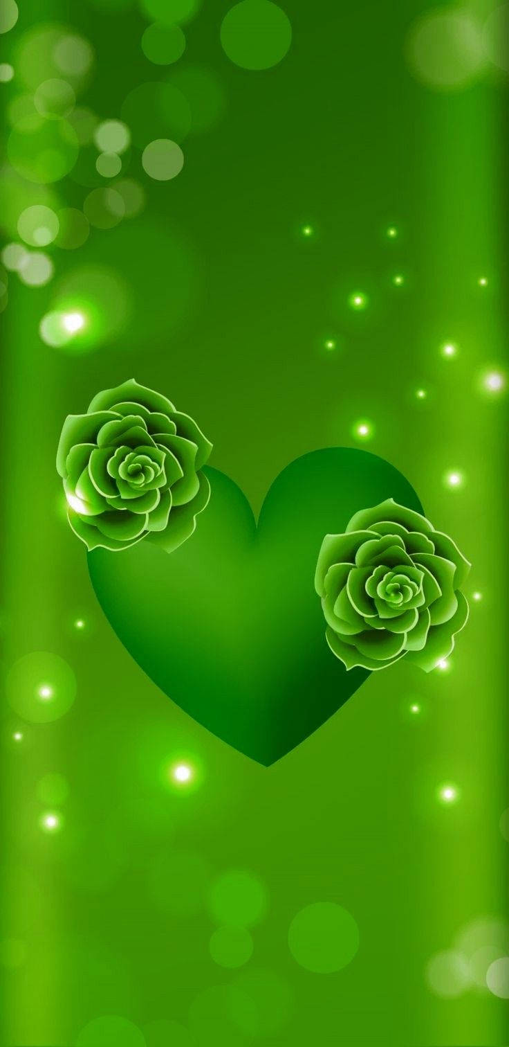 Green Heart 桌布 壁紙 — 一個發光的綠色心形，飾有多肉玫瑰，漂浮在閃爍的散景燈光中，背景是漸變綠色。