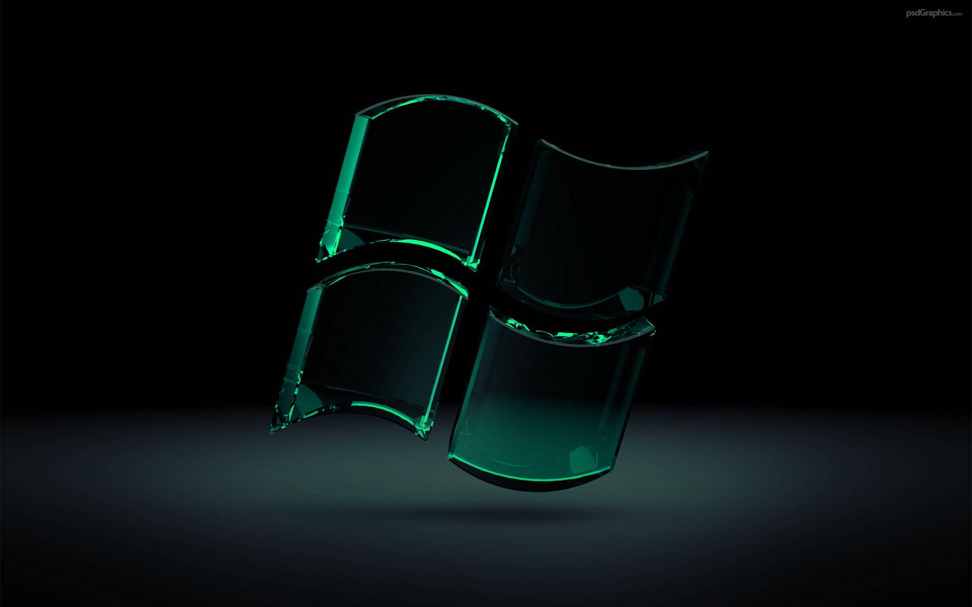Dark Windows 桌布 壁紙 — 一個發光的綠色玻璃質感Windows標誌漂浮在黑暗背景上，帶有柔和環境光。
