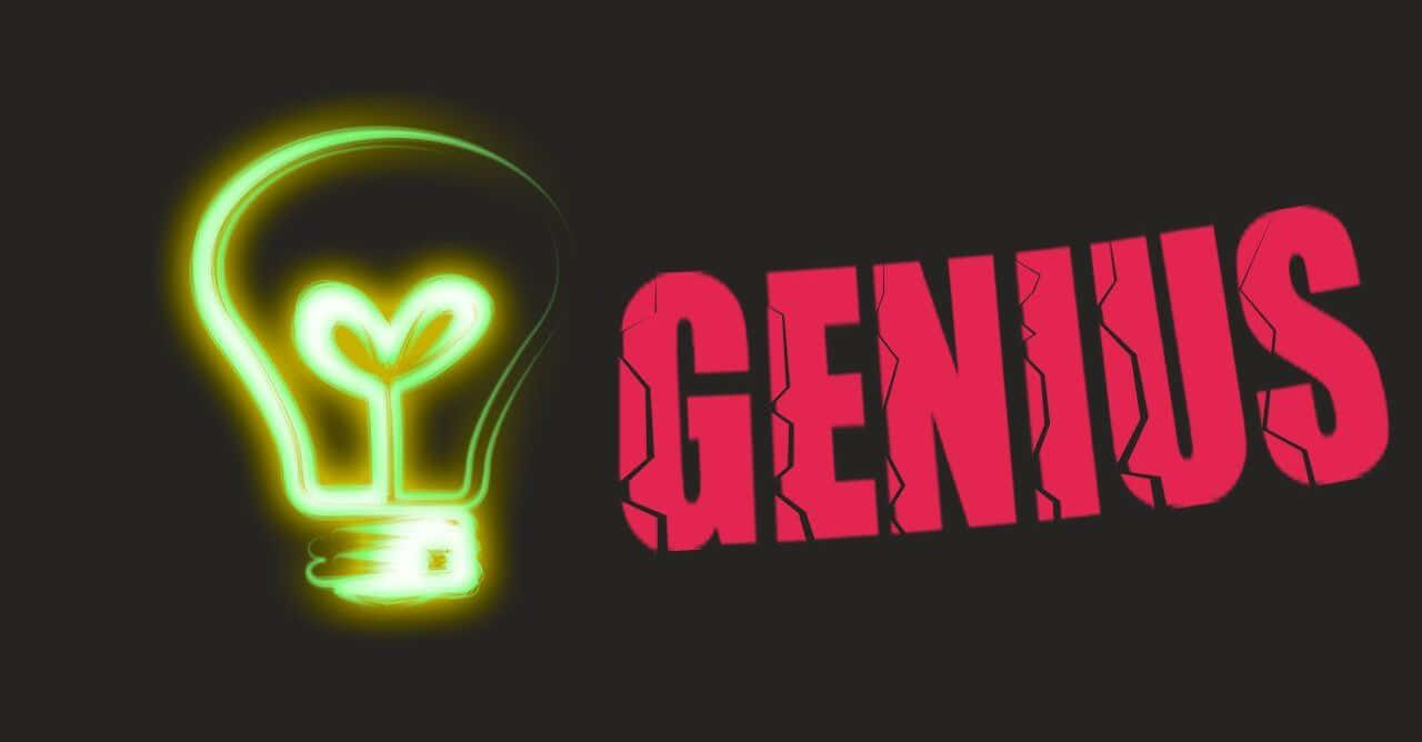 Dark Genius 桌布 壁紙 — 一個發光的綠色霓虹燈泡，帶有心形燈絲，旁邊是黑色背景上裂開的紅色字母GENIUS。