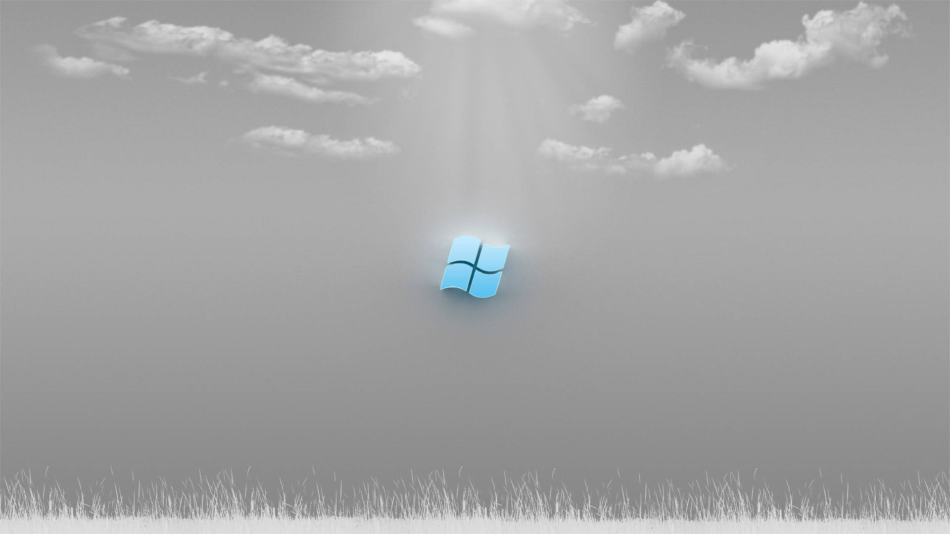 Windows 10 高畫質 桌布 壁紙 — 一個發光的藍色Windows標誌漂浮在單色天空中，下方是草地，陽光穿過雲層照射下來。