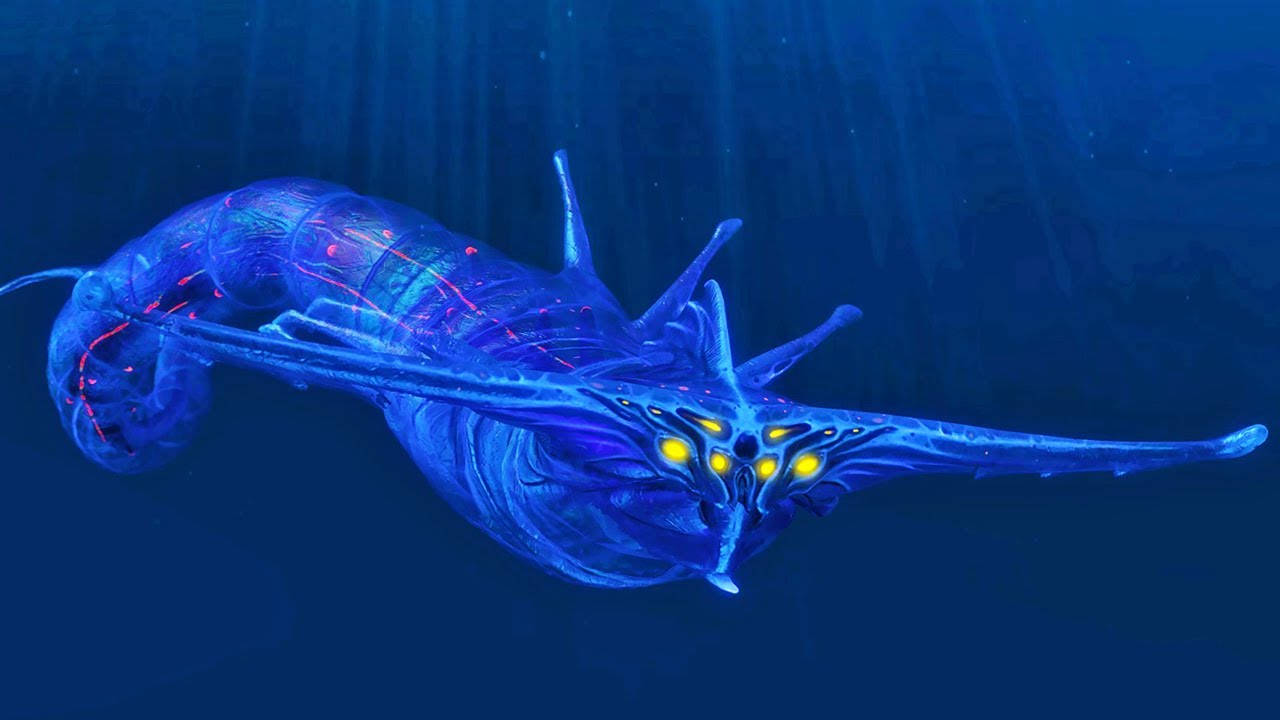 ghost leviathan 桌布 壁紙 — 一個發光的藍色外星生物，有著黃色的眼睛，在光線照射的深海中滑行。