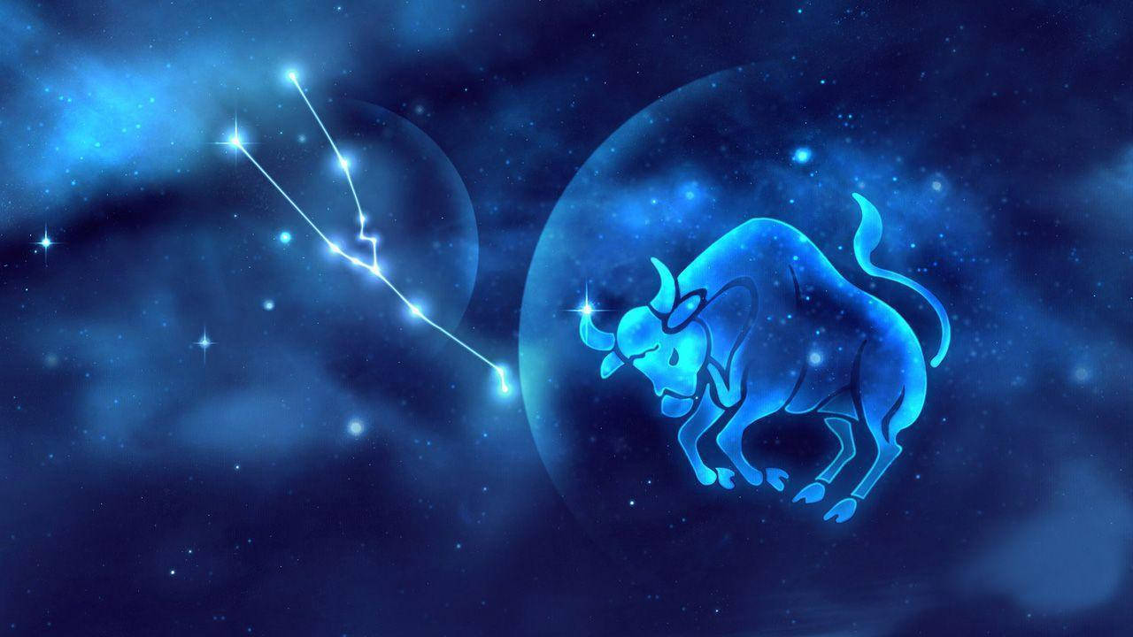 zodiac 桌布 壁紙 — 一個發光的藍色金牛座星座在星雲中閃耀，背景是繁星點點的宇宙。