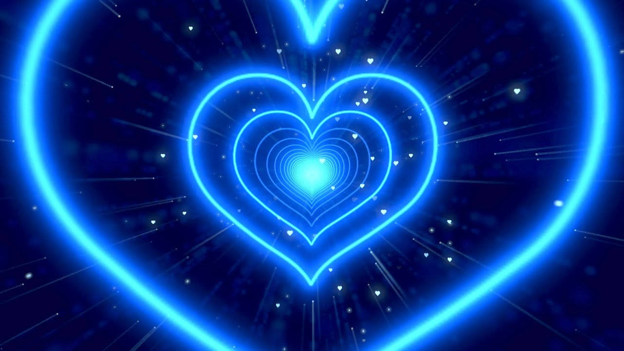 Blue Heart 桌布 壁紙 — 一個發光的藍色霓虹心形隧道，帶有同心輪廓和漂浮粒子，背景是黑暗的宇宙。