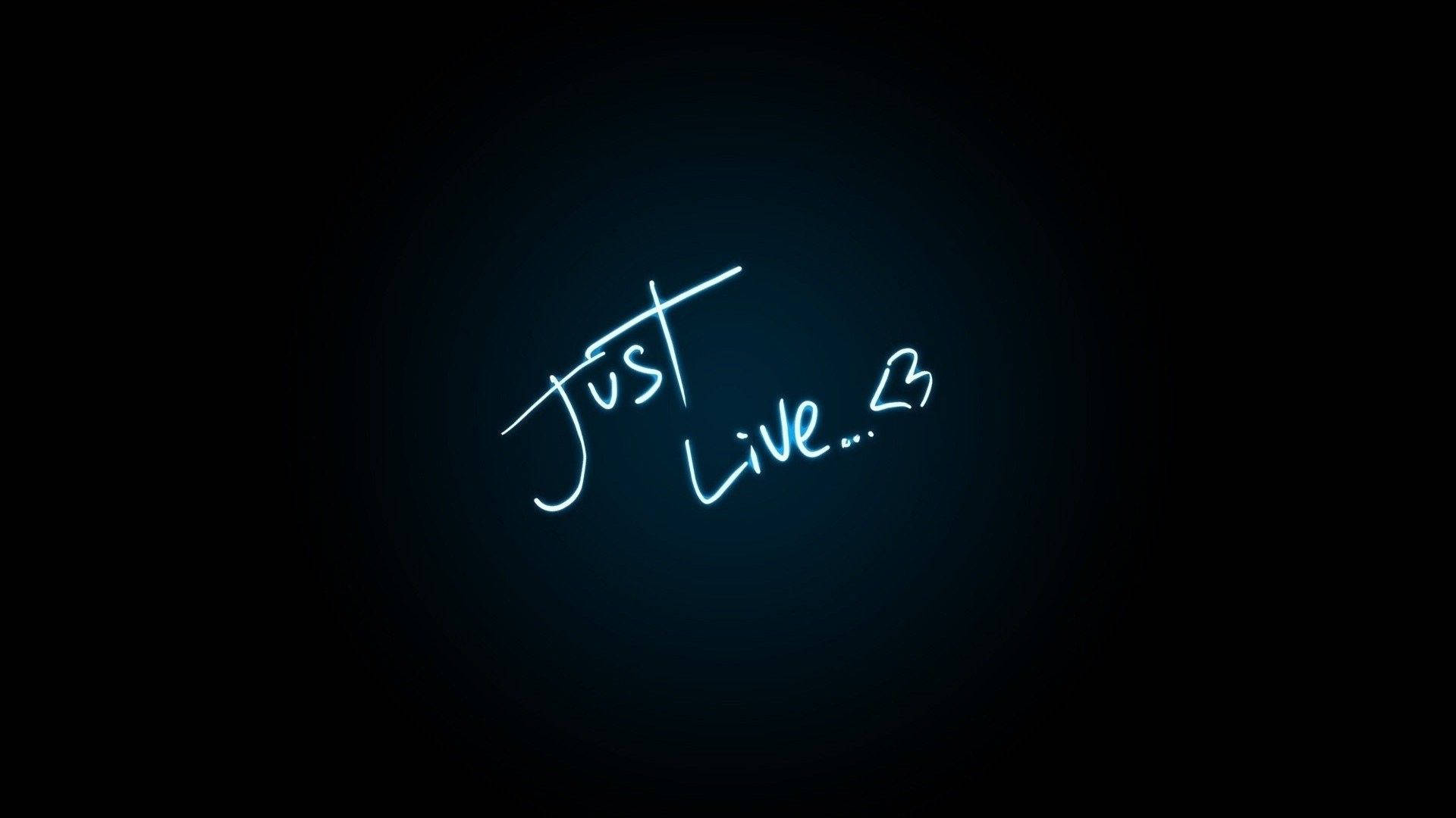 黑色愛情 桌布 壁紙 — 一個發光的藍色霓虹燈牌，上面寫著 'Just Live...B'，背景為深色，帶有微妙的徑向漸變。