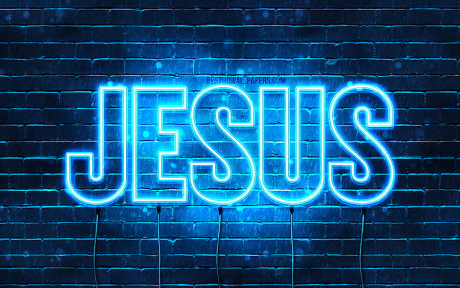 Jesus Name 桌布 壁紙 — 一個發光的藍色霓虹燈牌，拼寫出JESUS，用電光照亮了一面深色磚牆。