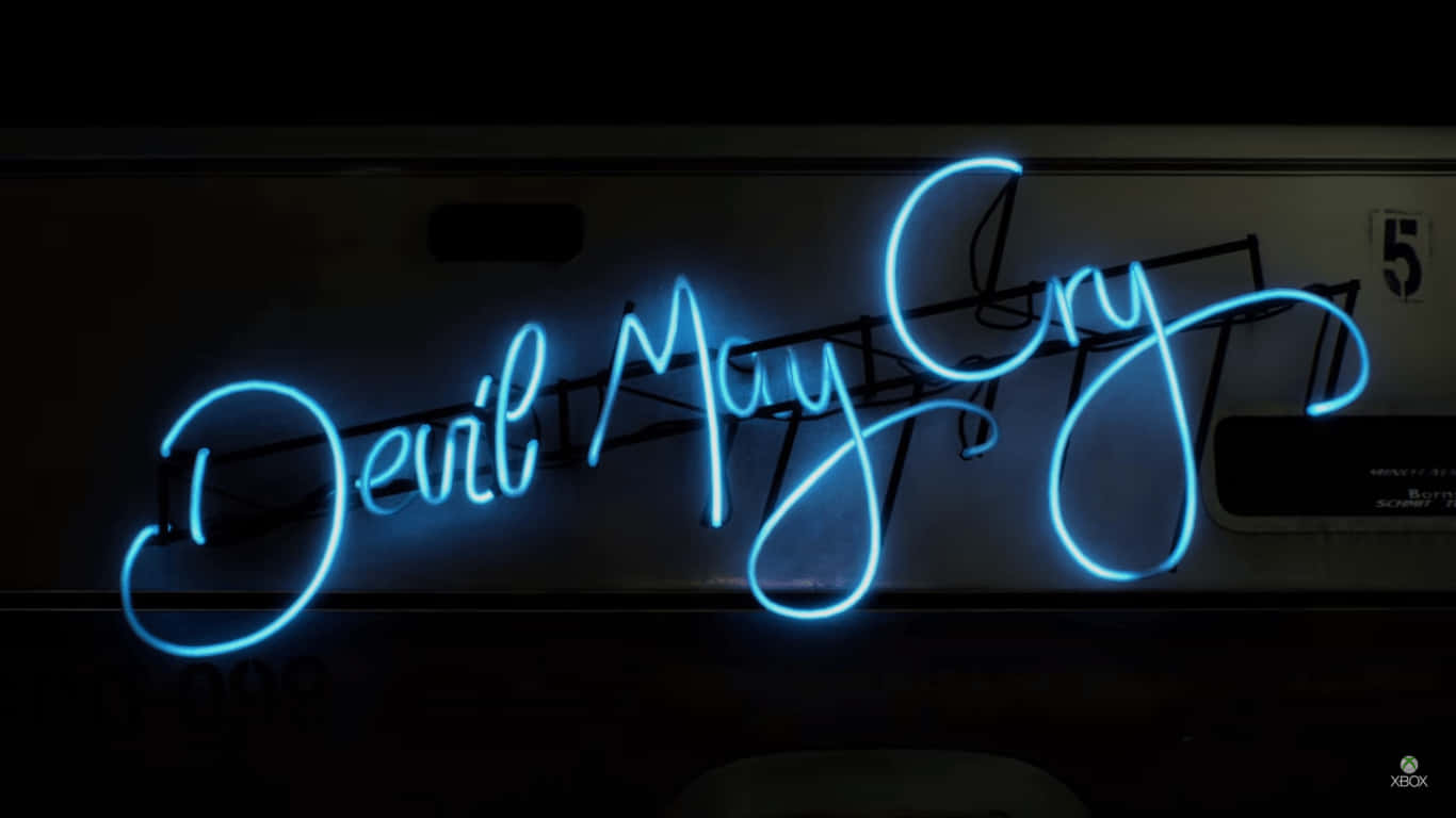Blue Neon Lights 桌布 壁紙 — 一個發光的藍色霓虹燈牌以草書拼出「Devil May Cry」，背景黑暗，可見電線和一個帶數字的面板。
