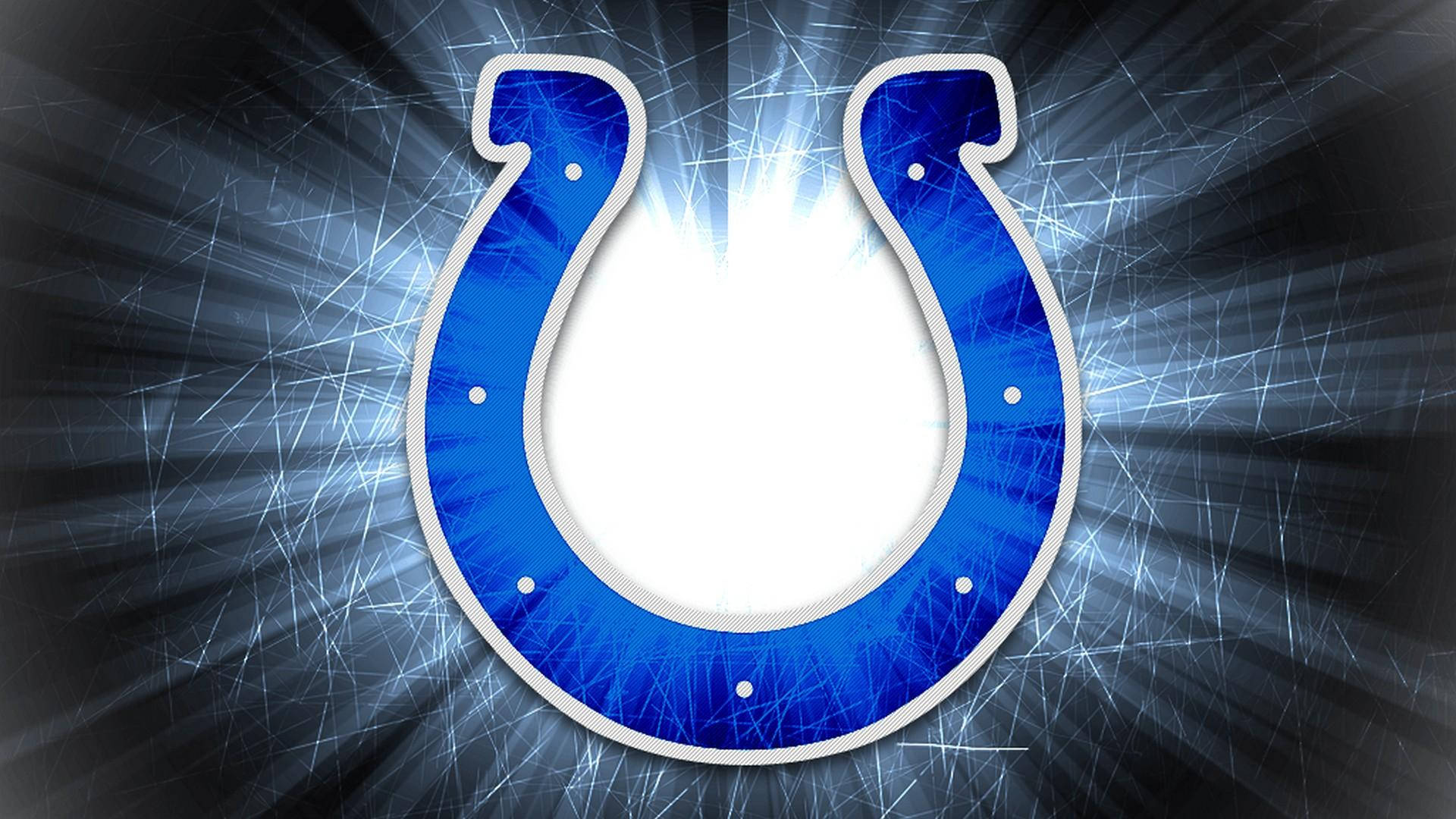 NFL 桌布 壁紙 — 一個發光的藍色馬蹄鐵標誌在黑暗的刮痕背景上散發出明亮的白色光芒。