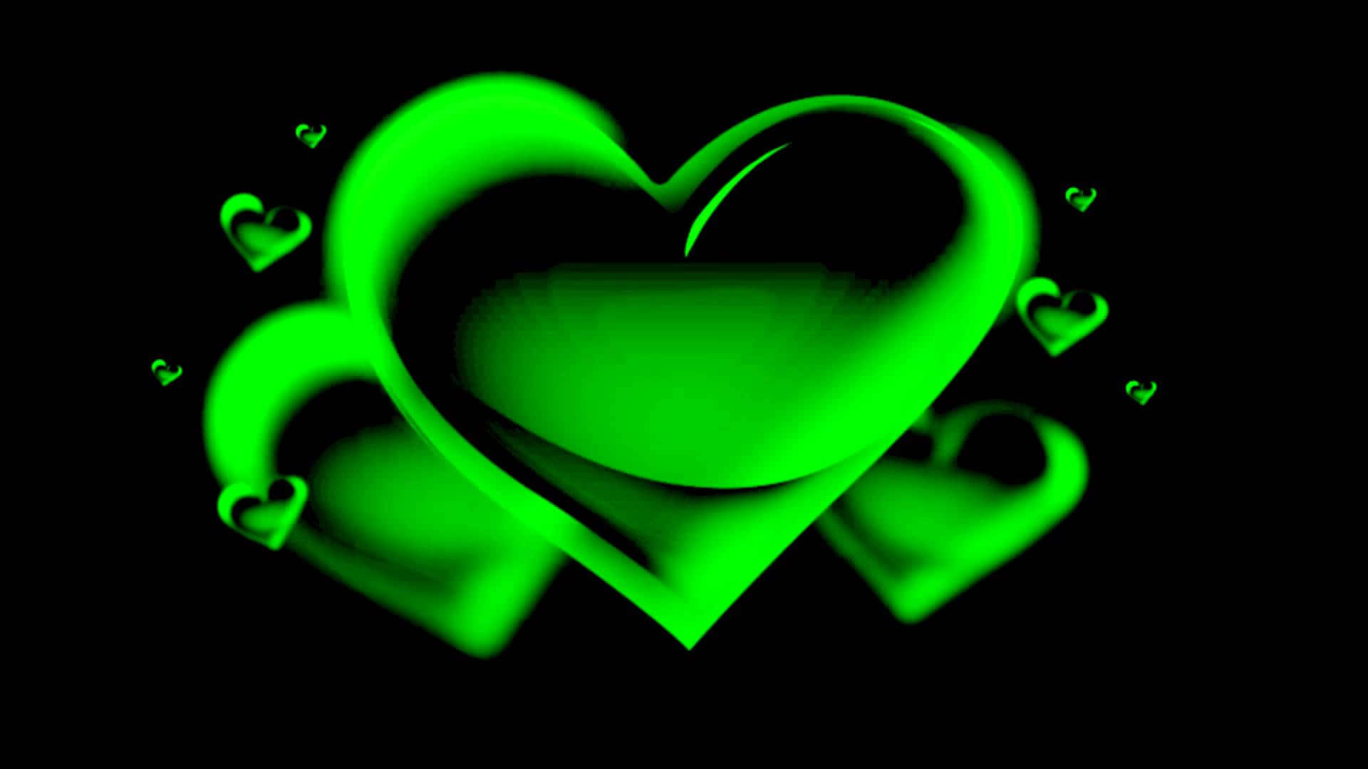 Green Heart 桌布 壁紙 — 一個發光的螢光綠色心形，周圍有較小的愛心漂浮在黑色背景上。